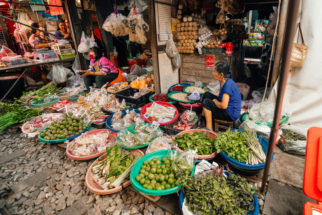Fresh fruit and vegetables for sale at a busy street market in Bangkok